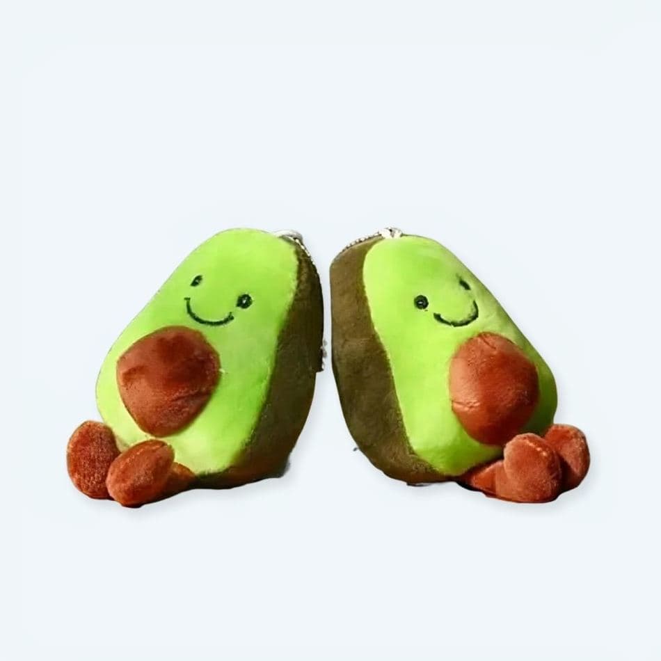 Plush fruit toys in urban park setting. Soft, cuddly avocado, banana, strawberry plushes for kids & gifts.
