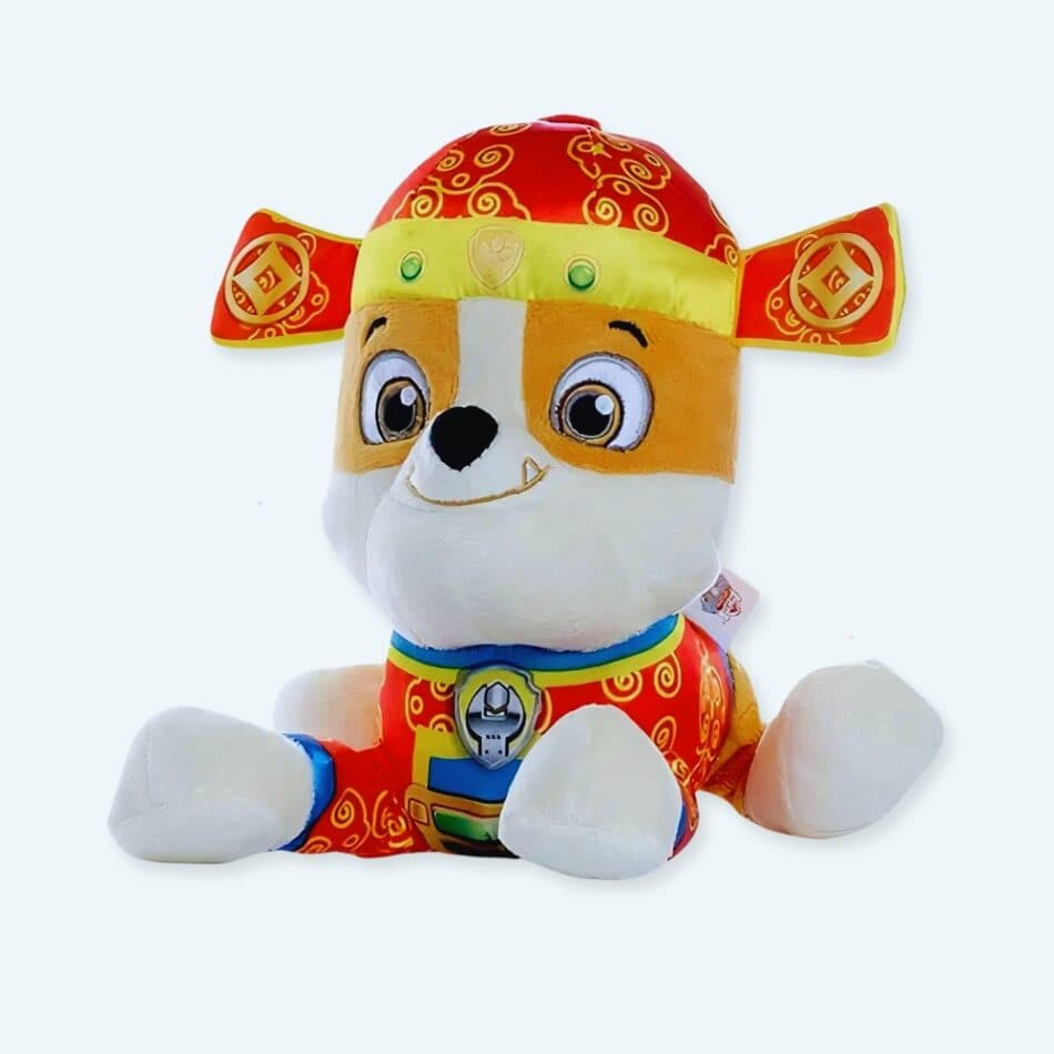 Paw Patrol plush toys, including Chase, Marshall & Skye, displayed. Soft, cuddly pup toys for kids in an urban setting. Great gift!