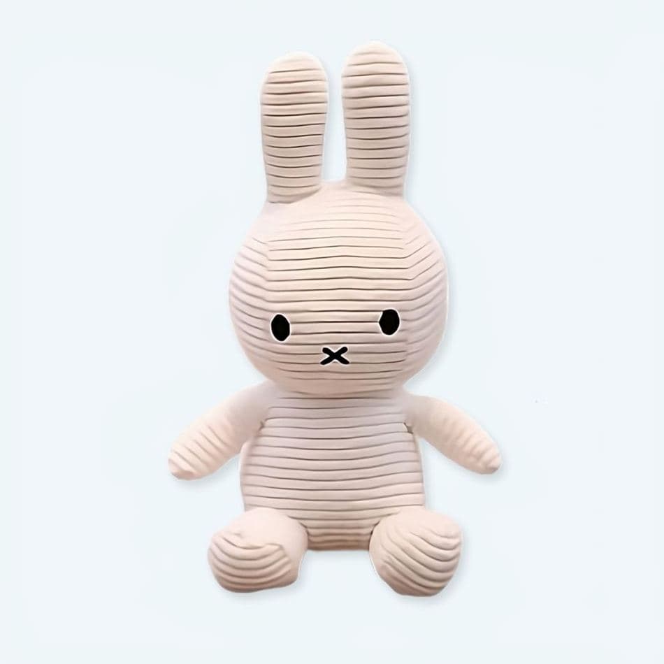 Miffy plush toys, bunnies, stuffed animals, baby gifts, kids toys, nursery decor, displayed in a bright, urban setting.